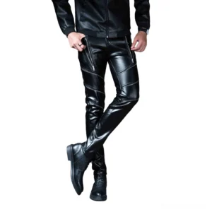 Men's gothic skinny faux leather biker pants with lace-up thigh details, front three-quarter view showing glossy black leather and slim fit silhouette