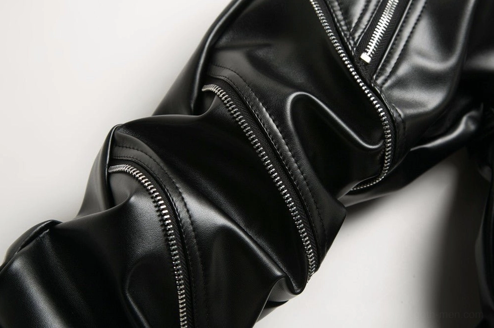 Leg side zipper details showing dual decorative zippers running down outer seams of dark fashion pants