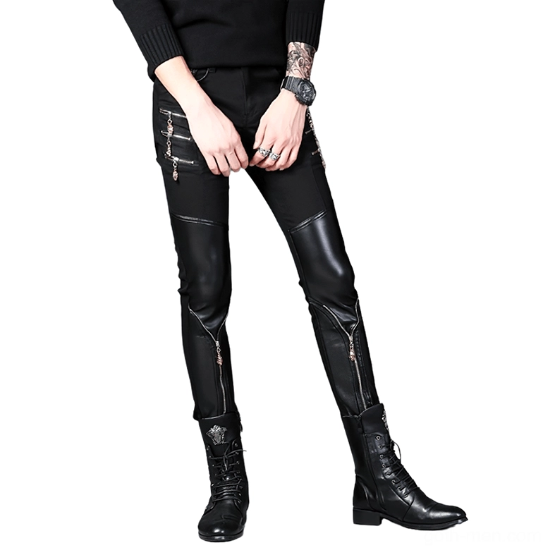 Close-up detail shot of black gothic patchwork biker slim pants - faux leather construction, decorative zippers, and punk aesthetic styling