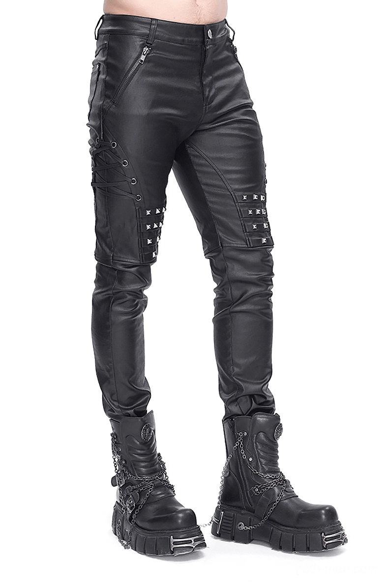 Men's black leather gothic biker pants with studded knee panels and metal accents, front three-quarter view