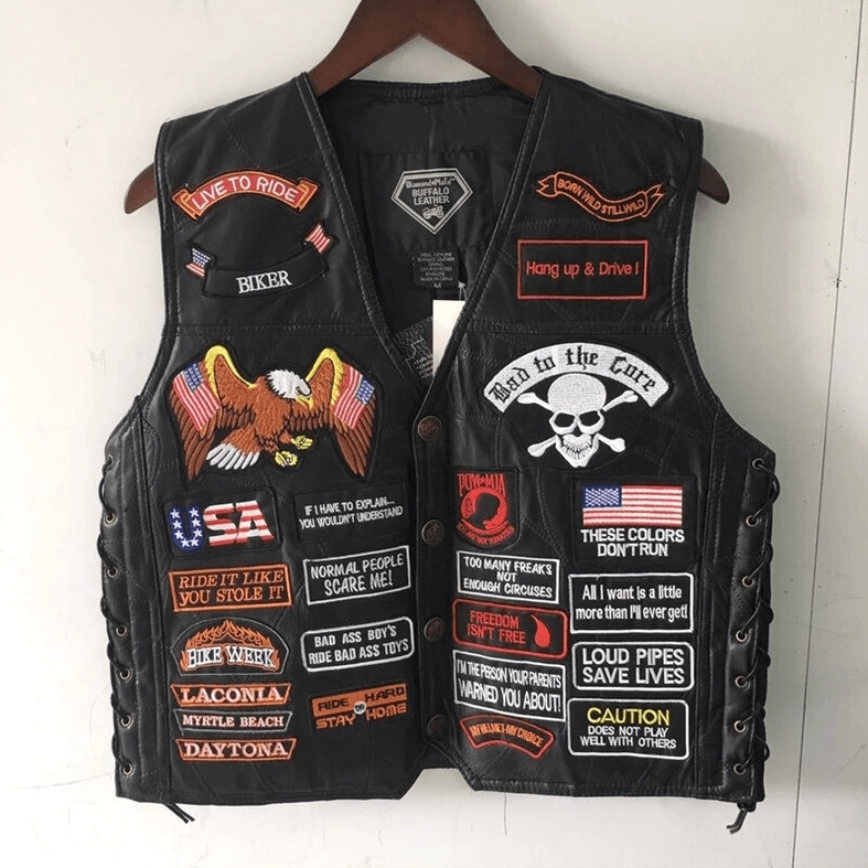 Front view gothic leather biker vest on hanger with button closure and patch decorations
