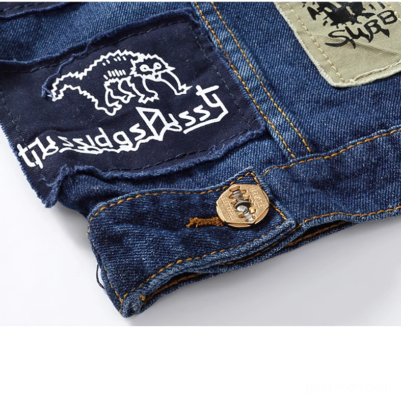 Side pocket and lateral patch section of blue gothic denim biker vest displaying animal-themed embellishment and khaki accent patch, showing detailed craftsmanship