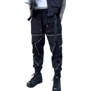 Men's black gothic cargo pants front three-quarter view with reflective piping and multi-cargo pockets