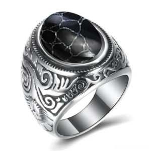 Gothic cracked black stone stainless steel ring with vintage engraved band, three-quarter view showing dark stone inlay and decorative metalwork