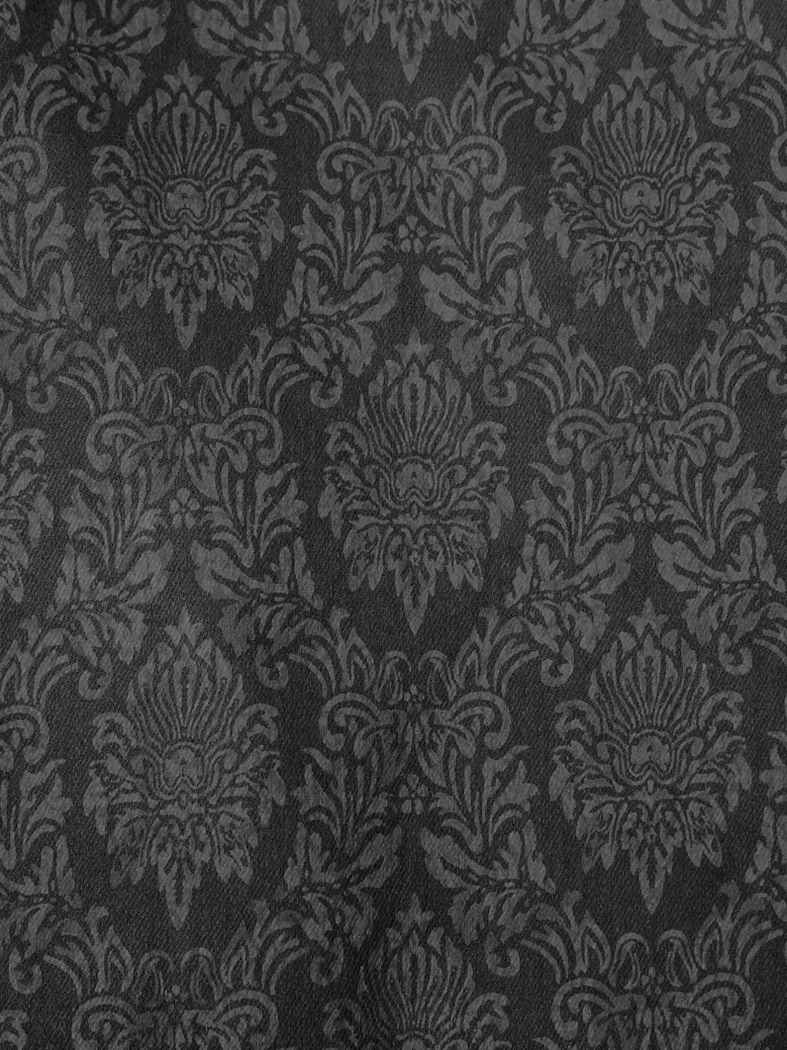 Black gothic vintage jacquard pants detail shot showing button placement and side seam construction with metallic accents