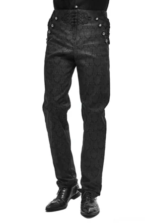 Black gothic vintage jacquard pants with silver button side decorations, worn by male model, front three-quarter view showing high waist and fitted silhouette