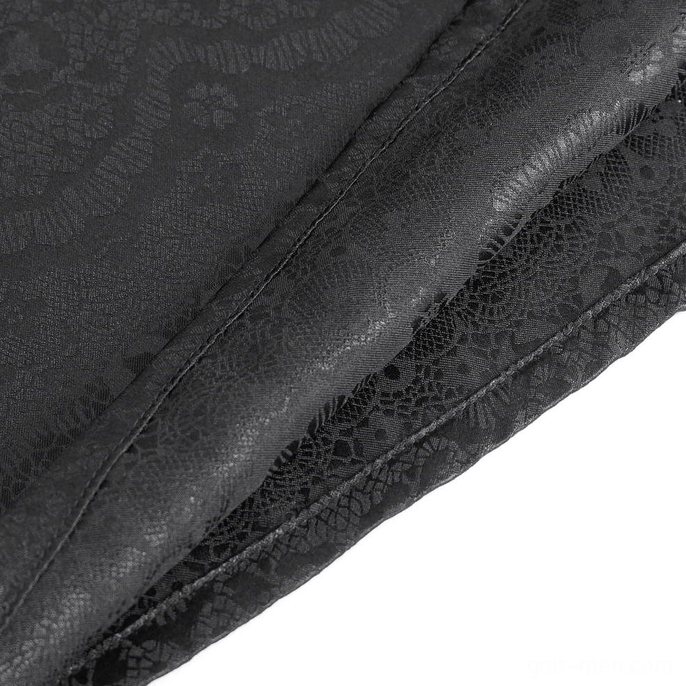 Fabric close-up of black lace gothic shirt showing embossed jacquard pattern and seam detail