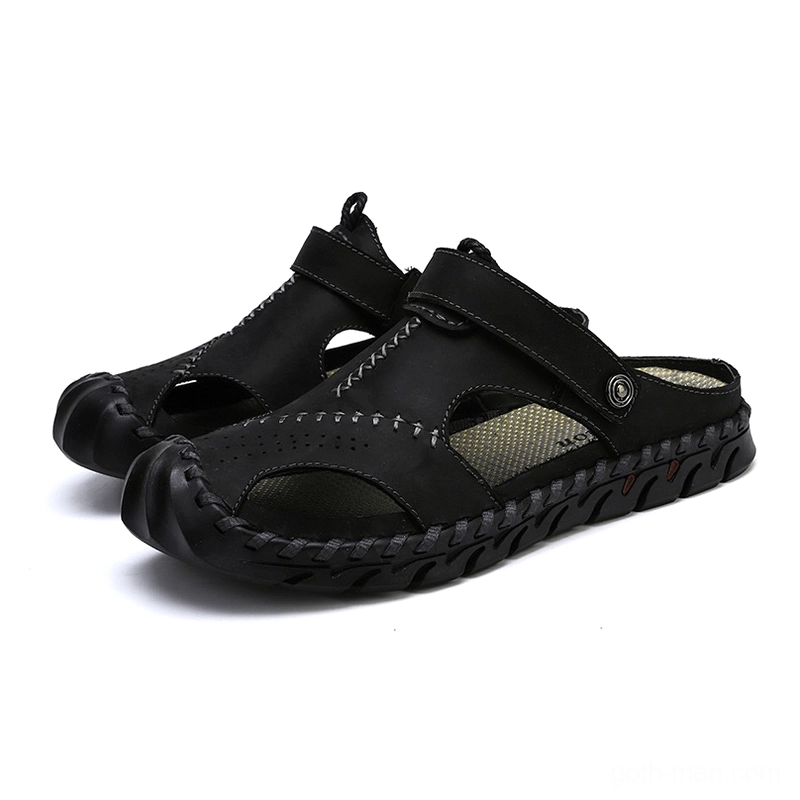 Men's black genuine leather gothic ankle-wrap sandals with hand-stitched detail - three-quarter front view