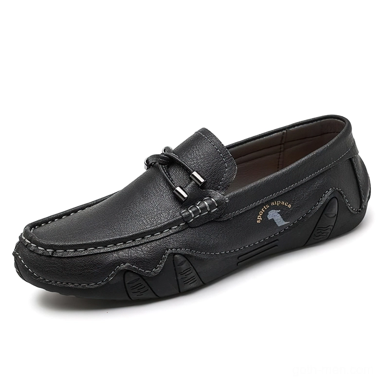 Black gothic loafers for men handcrafted with sleek minimalist design and logo detail