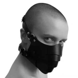 Black gothic layered face mask worn by male model, left three-quarter view showing metal rivets and adjustable straps