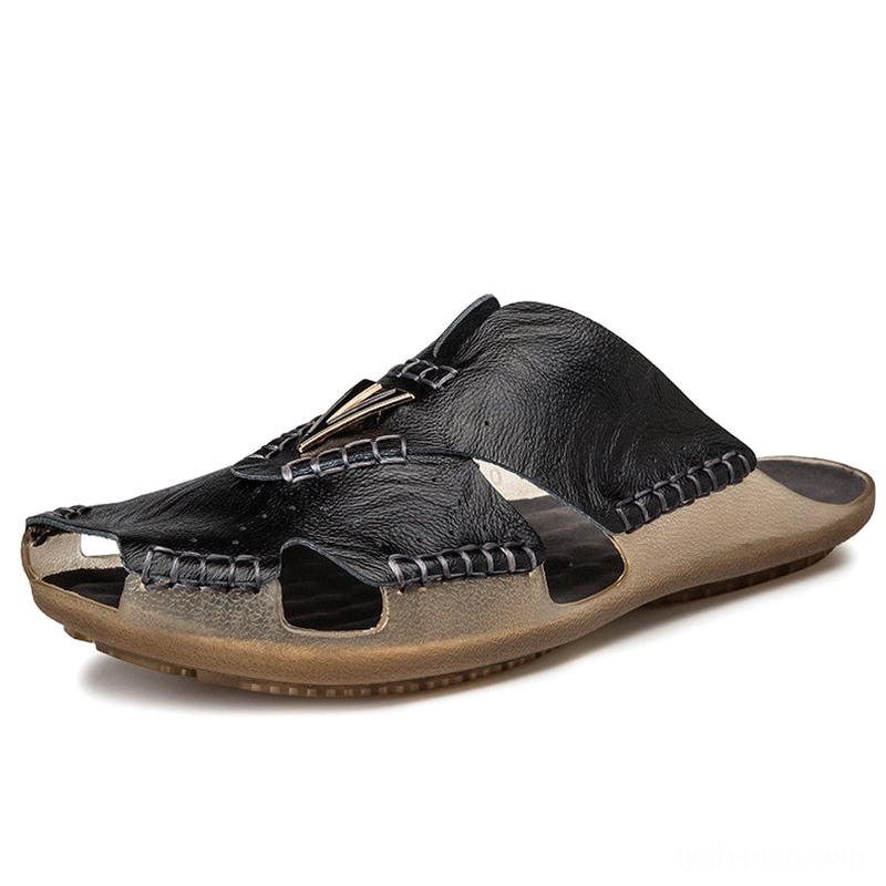 Black gothic leather slide sandal with front metal decor and cutout toe design, alternative fashion