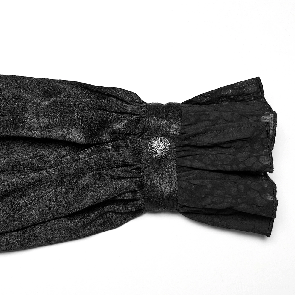 Ruffled cuff close-up of black Victorian gothic shirt with lantern sleeve and engraved metal button