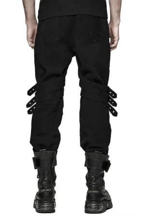 Black gothic slim-fit trousers with adjustable buckle straps, rear view on model