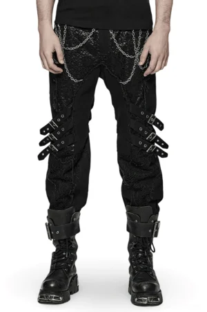Black gothic slim-fit trousers with metal chains and knee buckles, front view on model
