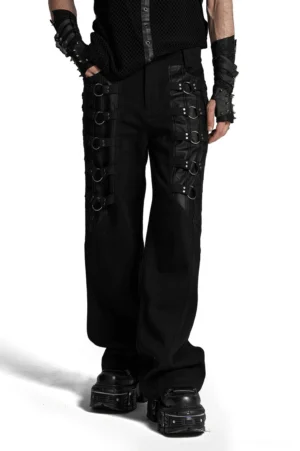 Wide-leg gothic black trousers front view with metal ring hardware on male model wearing punk gloves