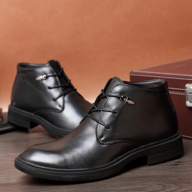 Black gothic boot crocodile grain texture upper material, side angle showing three-dimensional embossed pattern