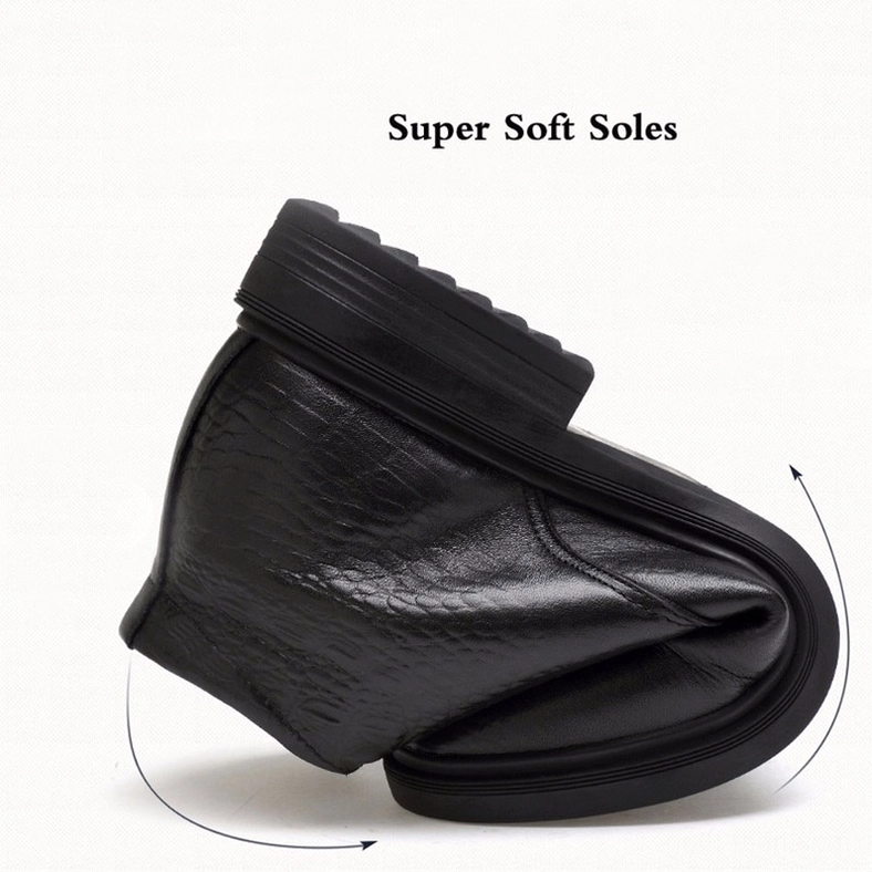 Men's black gothic smooth leather boot with metal fastener detail, lace-up system close-up