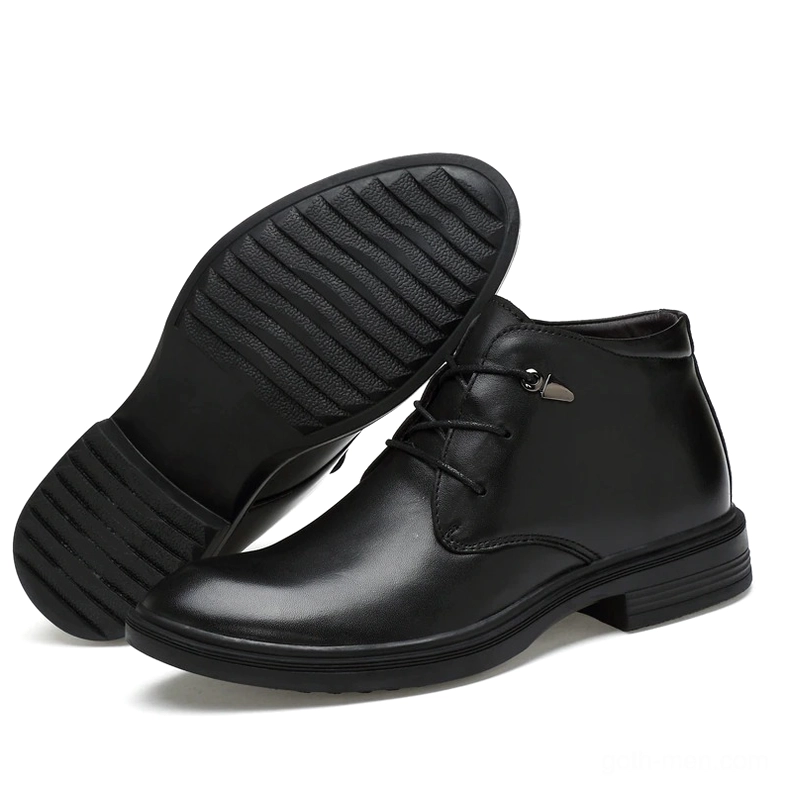 Black gothic boot sole and side profile showing rubber outsole with tread pattern and low block heel