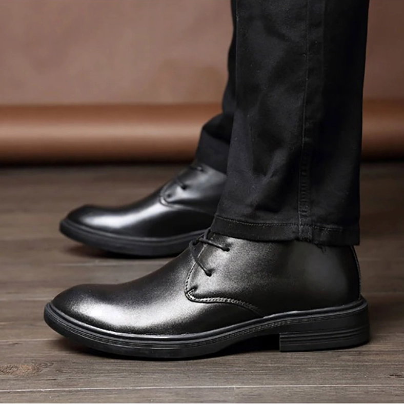 Men's black gothic leather ankle boot sole view showing rubber outsole grip pattern and construction