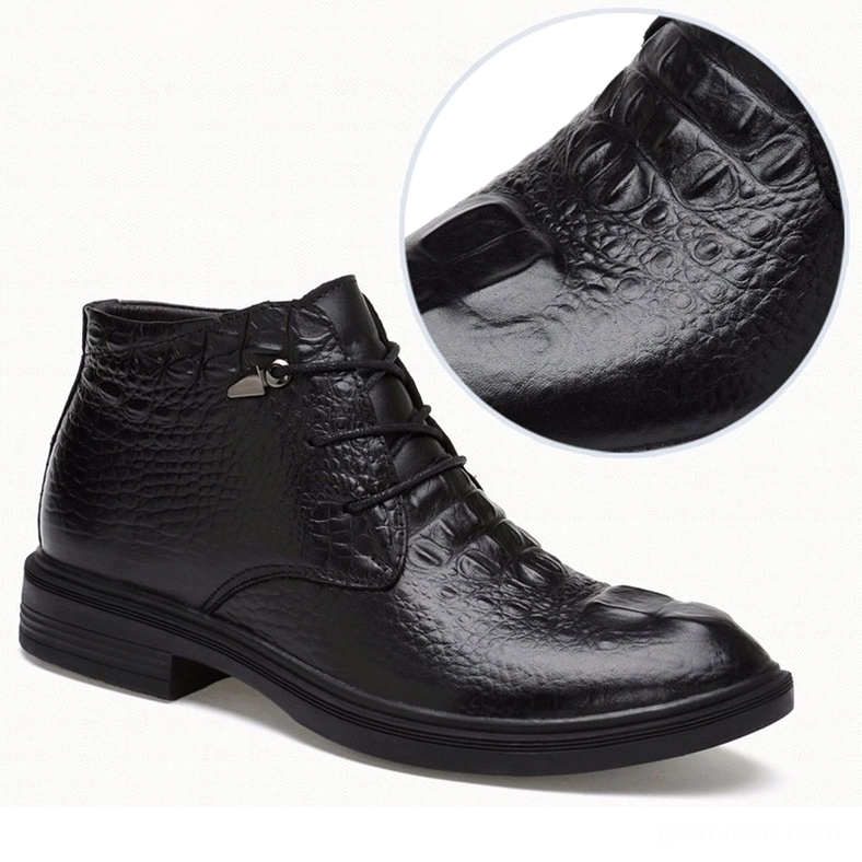 Black gothic ankle boot with textured leather upper, side view showing low block heel construction