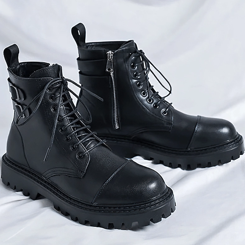 Paired black gothic ankle boots three-quarter view with cap toe design