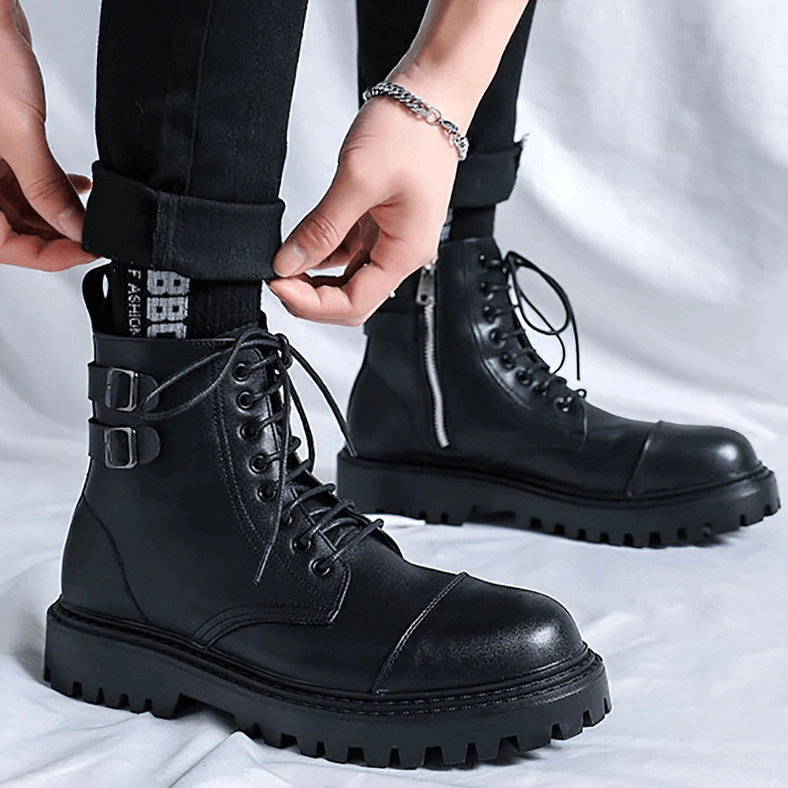 Black gothic ankle boots showing decorative stitching and construction quality