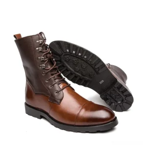 Men's gothic high-top boots displaying thick anti-slip lug sole and polished brown leather construction from side angle
