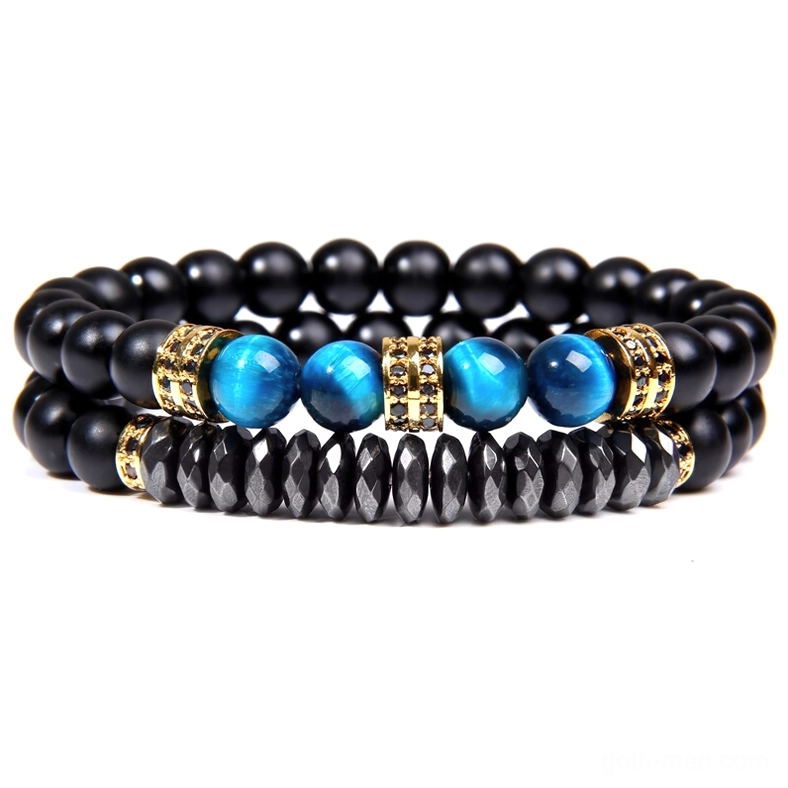 Gothic beaded bracelet with black matte beads, blue tiger eye stones, and gold metal spacers detail view