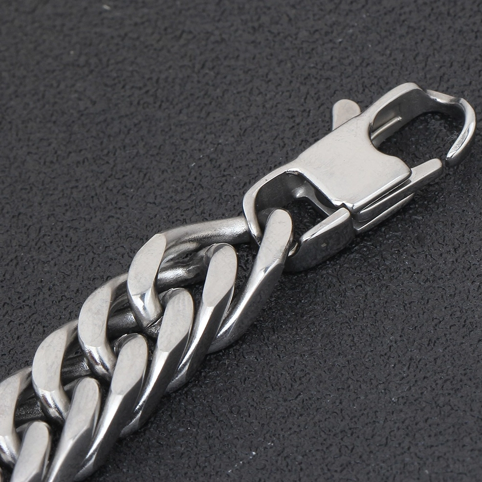Heavy-duty stainless steel lobster clasp mechanism on gothic chain bracelet close-up side view