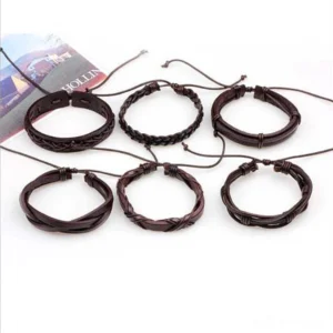 Complete collection of 6 brown leather braided gothic bracelets with adjustable rope closures arranged with magazine styling