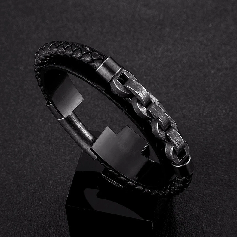 Close-up detail of men's hybrid gothic bracelet showing braided leather texture and gunmetal chain link craftsmanship