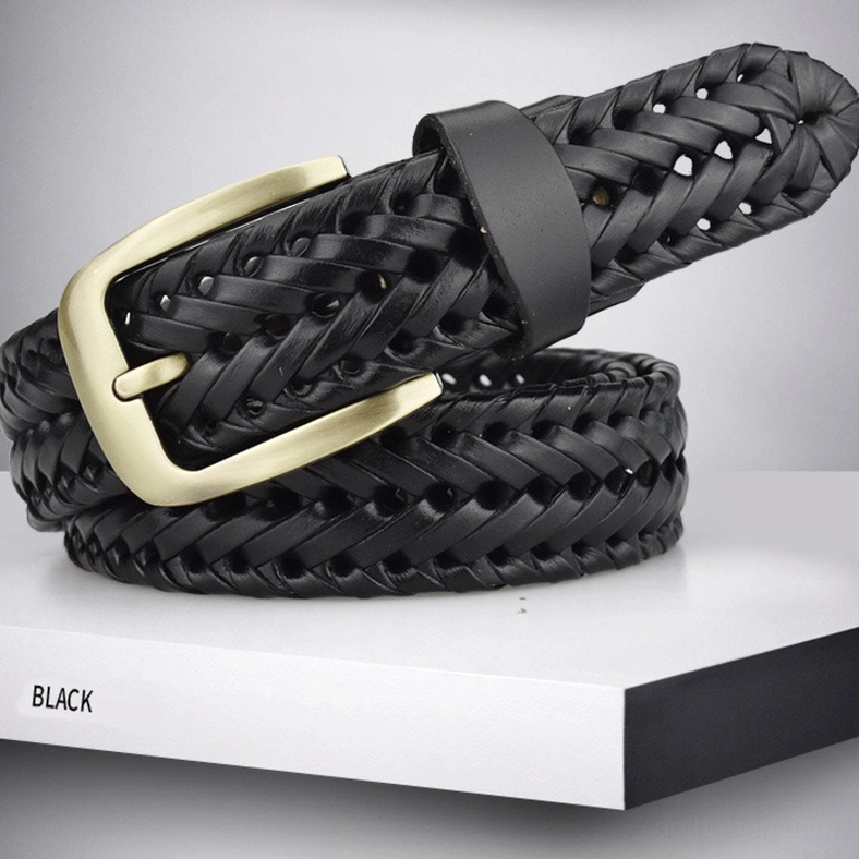 Hand-knitted gothic braided leather belt with metal buckle on neutral background