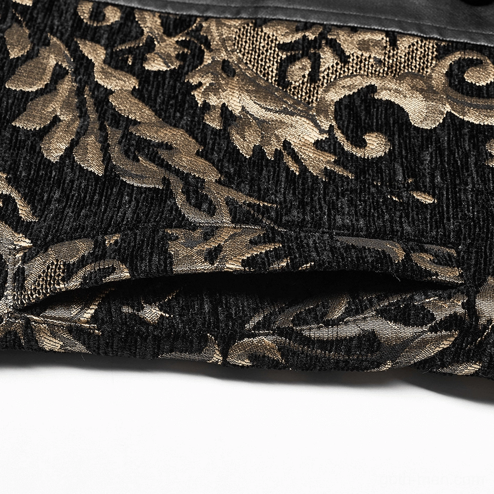 Black and gold brocade fabric close-up showing ornate damask floral texture and jacquard weave