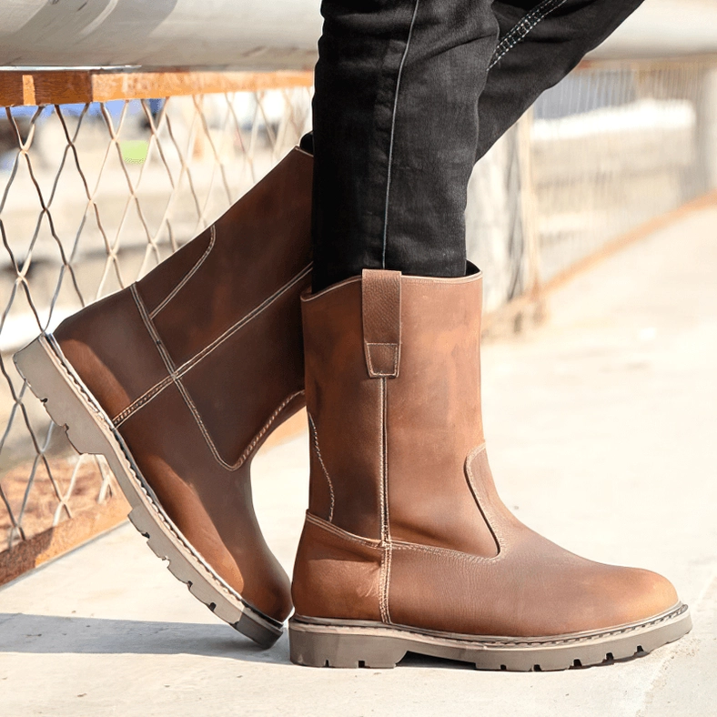 Gothic leather boots on model three-quarter low angle black jeans alternative fashion