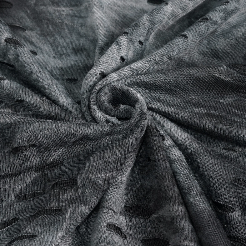 Gothic buckle strap detail on men's asymmetrical turtleneck, industrial metal hardware, functional design element
