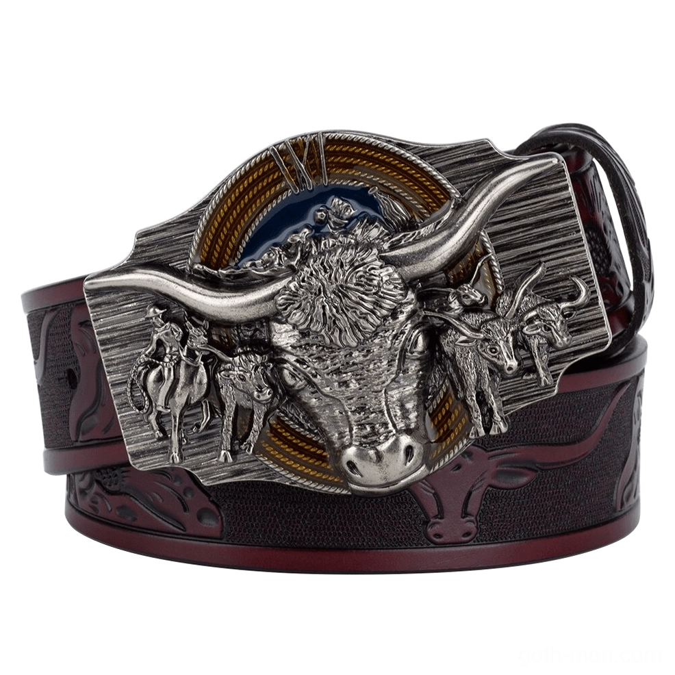 Vintage western bull head belt buckle detail showing dark reddish-brown leather and ornate metal work