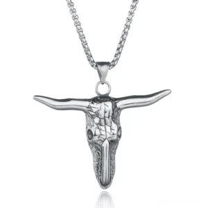 Polished stainless steel bull skull pendant with detailed engraved cracked bone texture and prominent horns, front overhead view