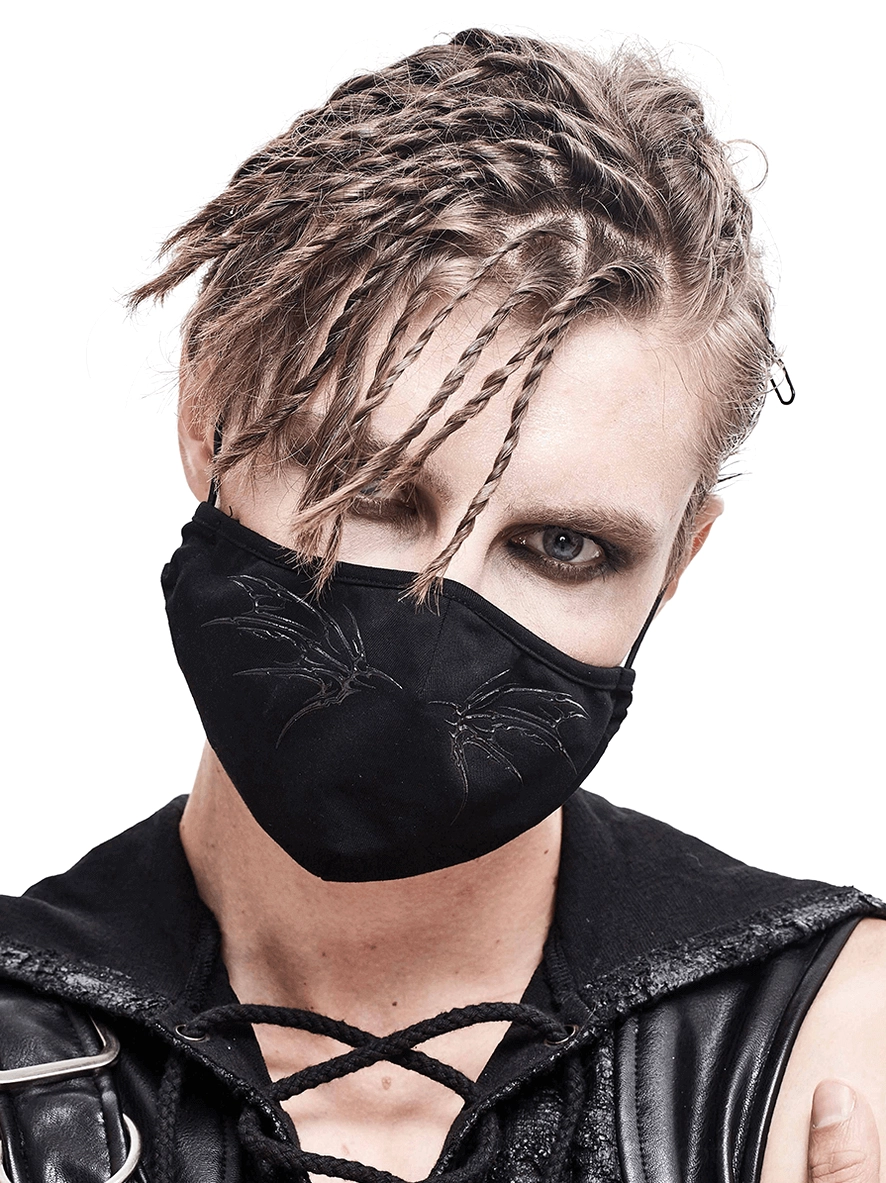 Close-up front view of black gothic butterfly face mask showing detailed silver wing embroidery and matte finish