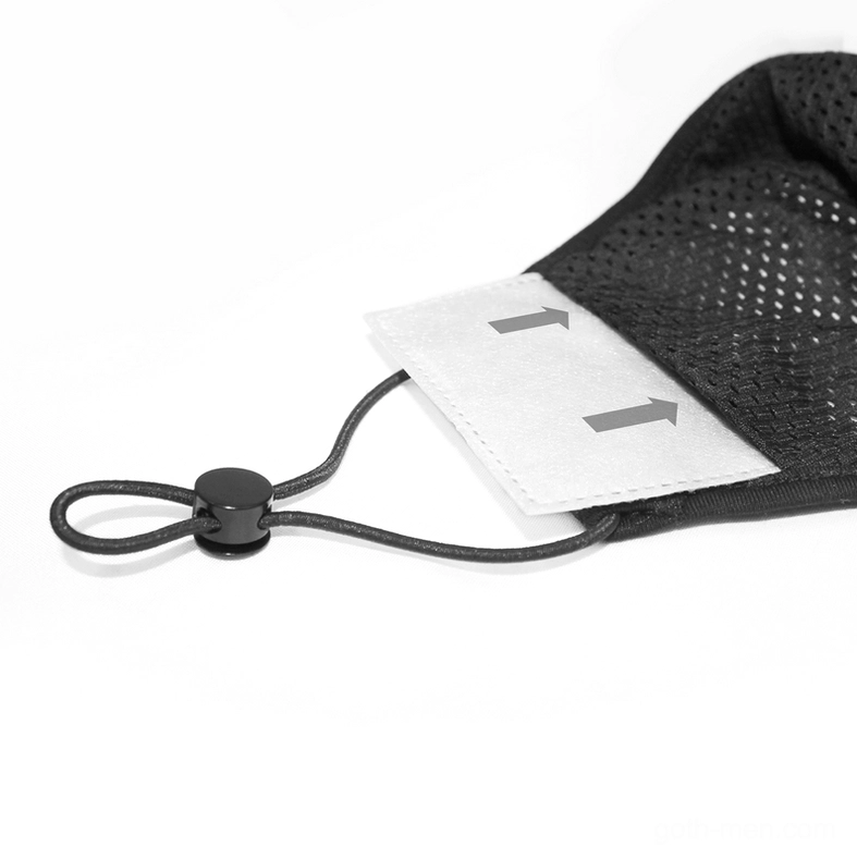 Close-up of face mask inner structure showing mesh layer and replaceable filter slot