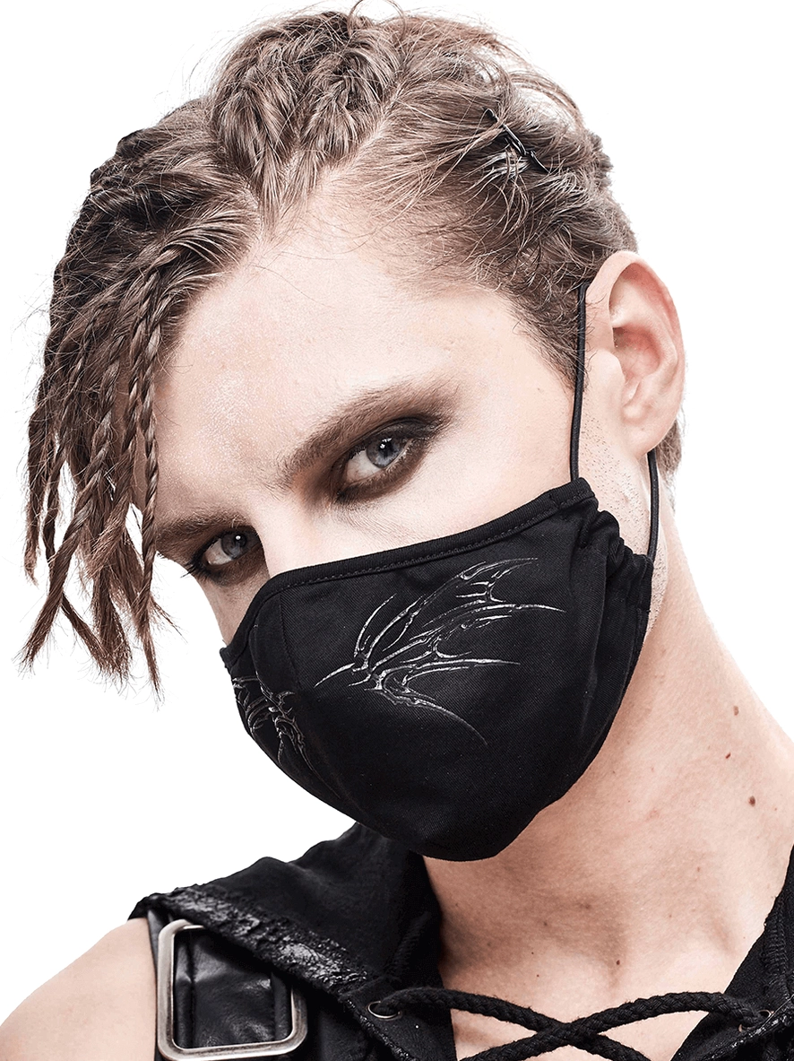 Male model wearing black gothic butterfly embroidered face mask with adjustable ear straps, three-quarter left view