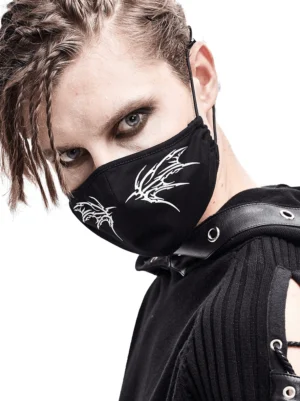 Black gothic butterfly face mask with white wing print worn by male model in studio, left side profile view showing adjustable elastic bands