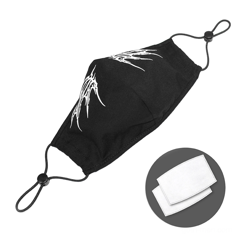 Gothic butterfly mask side view flat lay, black fabric with white wings, replaceable filter pads and elastic cord system