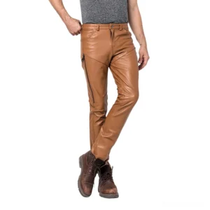 Camel tan leather skinny pants with side zippers crossed leg view
