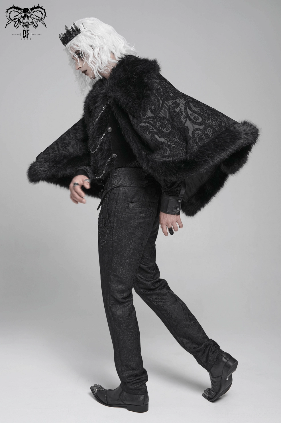 Black gothic cape back view on mannequin displaying luxurious faux fur hem and structural brocade fabric