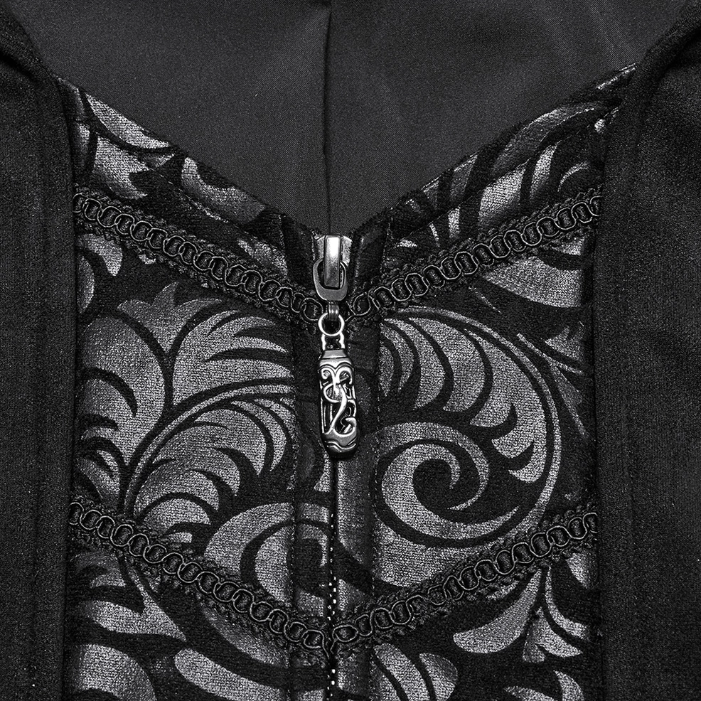 Close-up detail of black gothic cape coat inner embroidery and filigree decoration, showcasing ornate embroidered patterns and metal zipper hardware