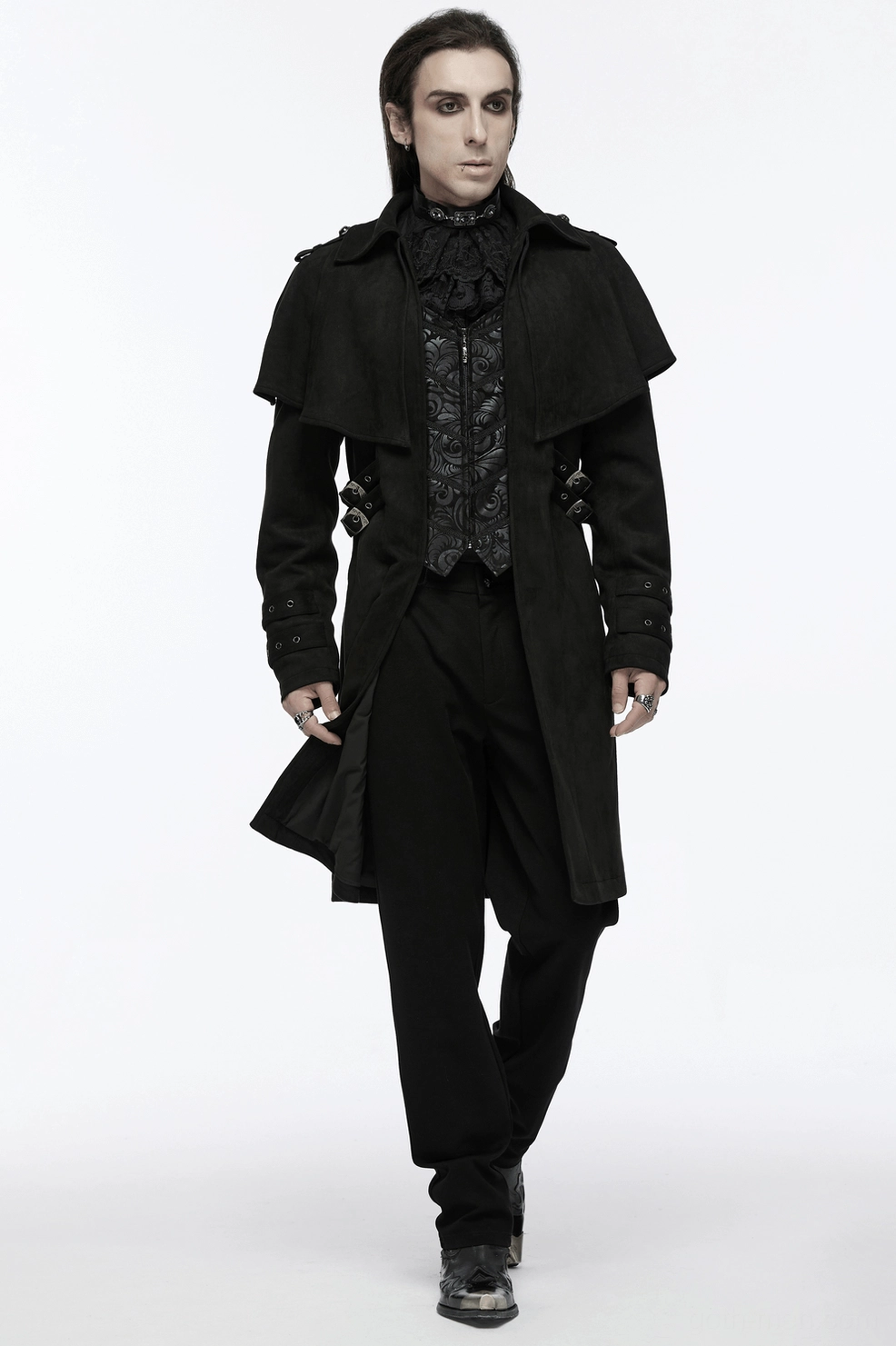 Black suede gothic cape coat sleeve and cuff construction detail highlighting tailored sleeve line, buckle strap placement, and hand-sewn metal hardware
