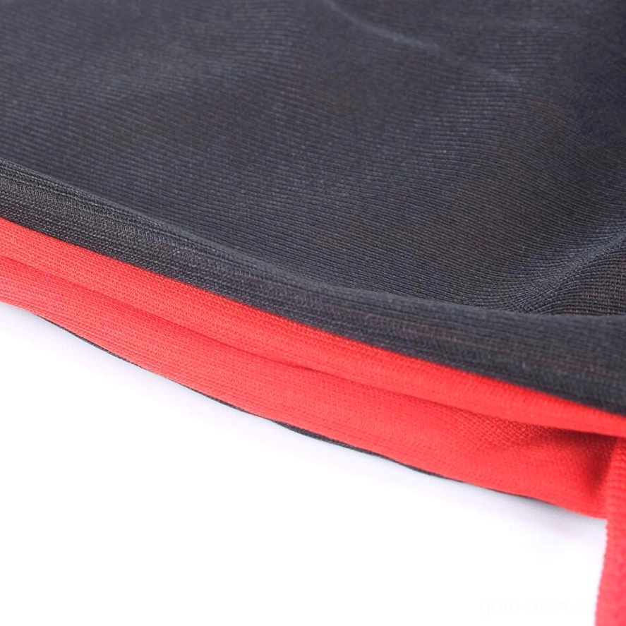 Gothic vampire cape fabric close-up showing smooth matte polyester texture and black-red layering