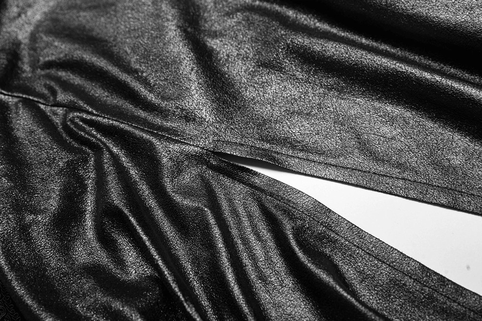 Black metallic satin fabric texture detail of gothic hooded cape showing shiny finished surface