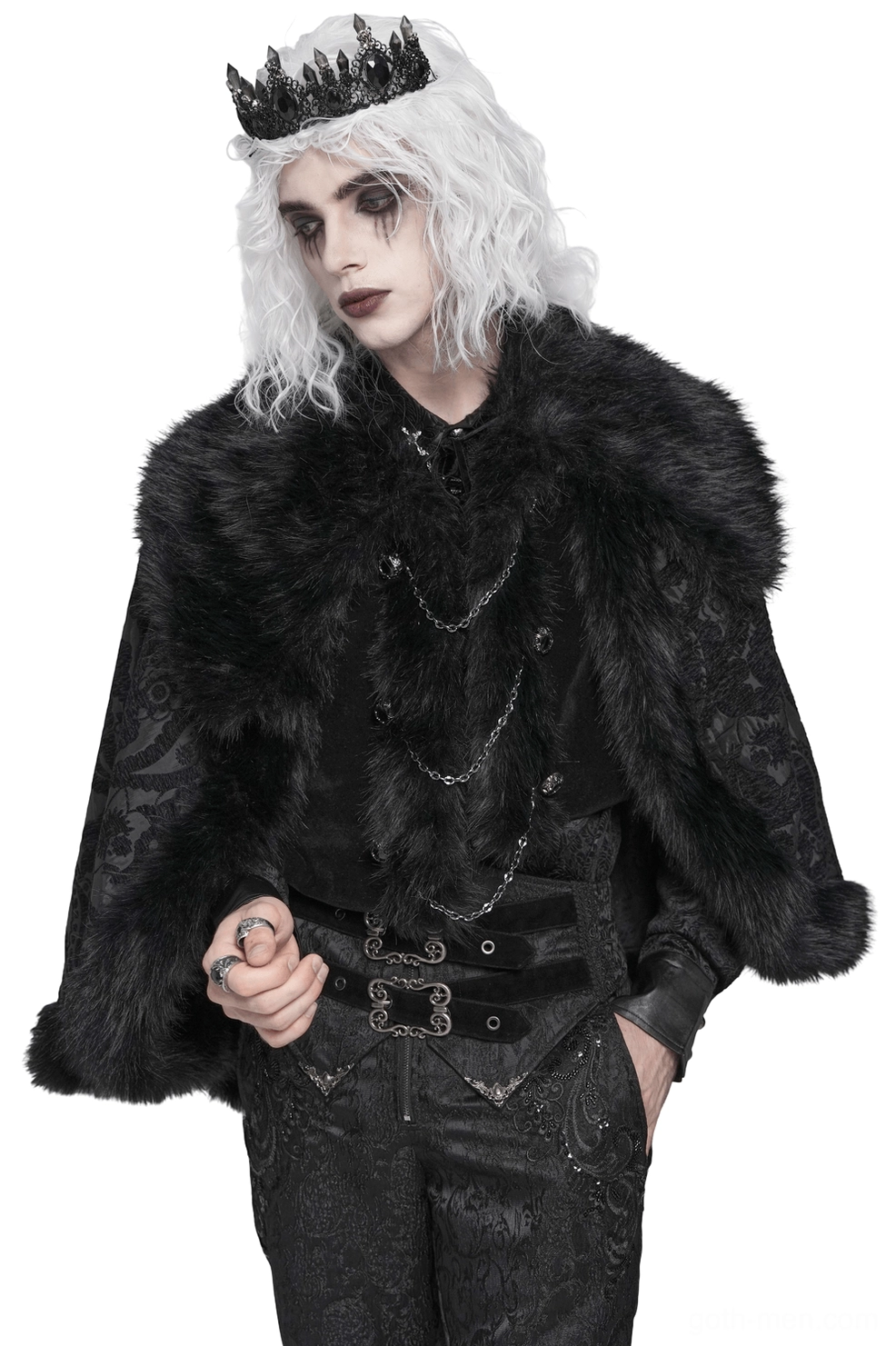 Black gothic cape with faux fur collar worn by male model with crown, front three-quarter view showing paisley brocade and decorative chains