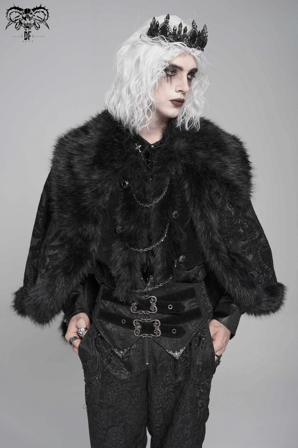 Front angled view of black gothic cape on mannequin emphasizing paisley brocade weave and faux fur details